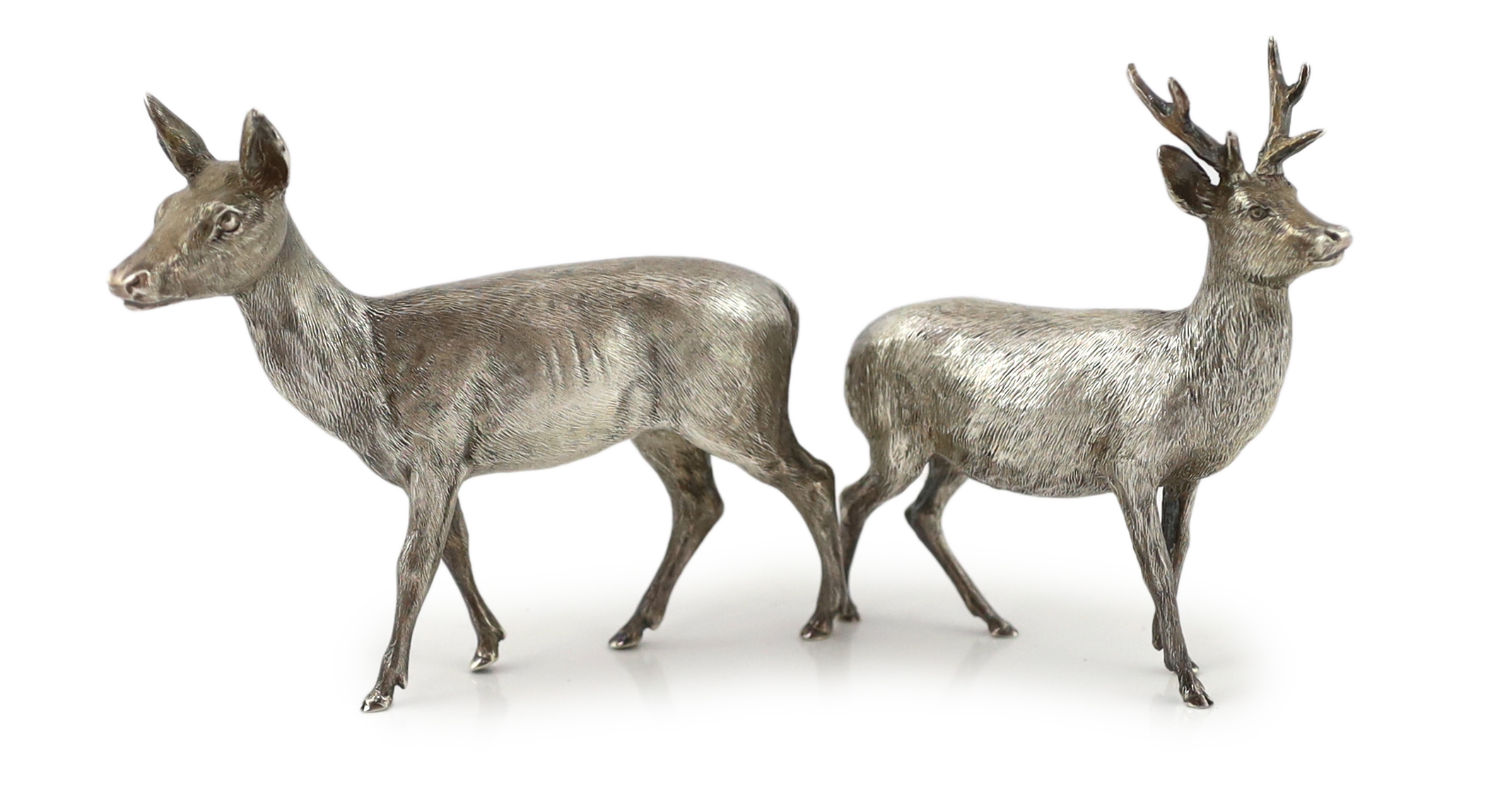 A pair of Elizabeth II Scottish silver free standing models of a stag and doe, by Hamilton & Inches